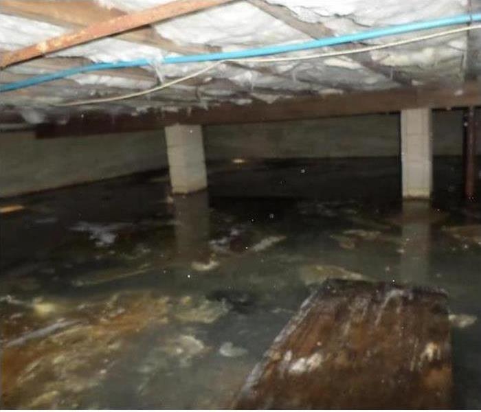 Flooded crawlspace with cinder block supports