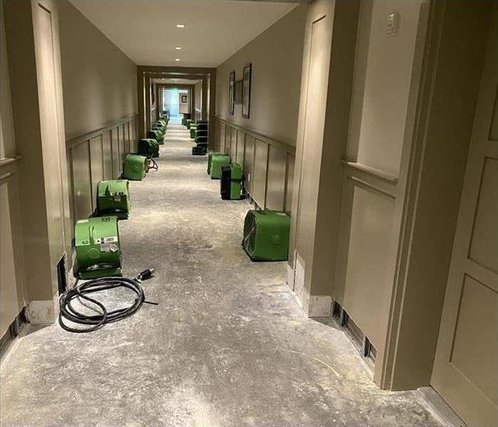 drying out water damage in a hallway